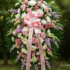 This funeral spray is a beautiful and elegant arrangement featuring a mix