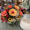 Our white ceramic pumpkin is filled with vibrant Autumn colors such as
