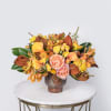 Featuring: Magnolia, Garden Roses, Mokara Orchids, Calla Lily, Spray Roses, &amp; Pieres