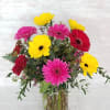 Select this bright and fun arrangement of gerbera daisies in a clear