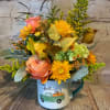 This fun oversized fall mug comes filled with roses, hydrangea, and a
