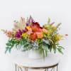 Seasonal flowers artfully combined to create an elegant yet wild arrangement showcasing
