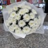 Hand-wrapped bouquet of fresh white mums. A timeless and elegant choice, available