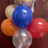 6 latex balloons and 1 mylar balloon arranged on a plastic stand