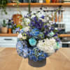 Arranged in a sleek 5&rdquo; x 5&rdquo; clear vase, this stunning bouquet