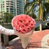 An opulent bouquet of garden roses, radiant in pink elegance and timeless