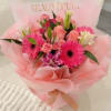 Bright pink gerberas, lilies, carnations, and roses come together in this fresh