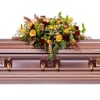 Celebrate a beautiful life with this deep array of fresh blooms.