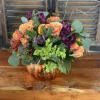 With this arrangement, the sunflower will brighten you up as the pumpkin