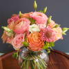 A lovely peach arrangement with a monochromatic peachy pink color scheme. This