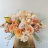 A lovely peach arrangement with a monochromatic peachy pink color scheme. This