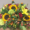  Bright and boldl colors featuring sunflowers in this large floral arrangement.