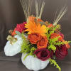 Perfect for a fall centerpiece, birthday or Halloween party, this flower-filled ceramic