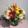 This bountiful array of autumn blooms is arranged in a large clear