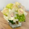 This elegant bouquet of cymbidium orchids, roses and hydrangeas arranged in a