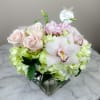This elegant bouquet of cymbidium orchids, roses and hydrangeas arranged in a