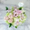 This elegant bouquet of cymbidium orchids, roses and hydrangeas arranged in a