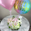 This elegant bouquet of cymbidium orchids, roses and hydrangeas arranged in a