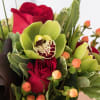 Elevate any space with our stunning modern arrangement featuring classic red roses