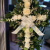 Our Carnation Cross is highlighted with a dozen carnations with greenery and