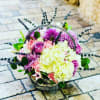 FRESH AND AROMATIC LILIES, ROSES, DRY LAVENDER, CARNATIONS, AND HYDRANGEAS IN A