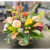 This is the perfect centerpiece for Thanksgiving. It contains roses, cremones, hypericum