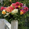 A beautiful tall arrangement full of in season Dalia&rsquo;s, peonies and beautiful