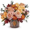 With its unique tree bark-inspired design, this magnificent vase featuring an autumnal