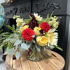 A beautiful vase of summer blooms including amaranthus, dahlias, sunflowers, zinnias and