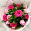 A romantic bouquet of fresh roses in shades of soft blush and