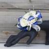 Classy white and bright blue blooms and greenery are showcased on a