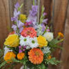 This bright and and gorgeous bouquet stands tall and is full of