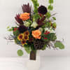 Sophisticated autumn arrangement, in a beautiful keepsake container that you can re-use