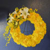 Yellow sympathy wreath with a lovely bouquet of orchids and roses cascading