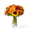Capturing the beauty of the season, this arrangement brings all the warmest