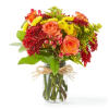 Bring the fall festivities inside with this seasonal favorite! Orange roses, red