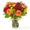 Bring the fall festivities inside with this seasonal favorite! Orange roses, red