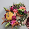 Embrace the beauty of autumn with our wrapped arrangement, filled with vibrant