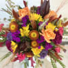 Embrace the warmth of autumn with Fall Fiesta by Westford Florist. This