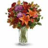 Brighten any fall day with this colorful array! Gorgeous orange lilies arranged