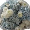 bouquet of blue hydrangeas and white ranunculus is the embodiment of elegance