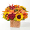 Embrace the season with this autumn blend of sunflowers, orange roses and