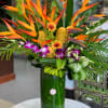 Yellow tropical flowers in vase 
