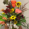 A mix of all the colors of the Fall season. The arrangement