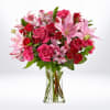 This stunning bouquet features vibrant hot pink roses and elegant pink lilies