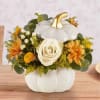 A plentiful mix of blooms gives our autumn arrangement an undeniable charm.