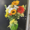 Fresh flowers in green vase 