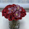 Top quality red roses in a beautiful transparent cylinder