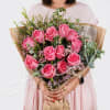 A gorgeous wrapped bouquet designed with premium 1 Dozen Pink Roses, Wax