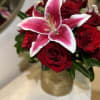 &ldquo;A breathtaking arrangement of velvety red roses paired with elegant stargazer lilies